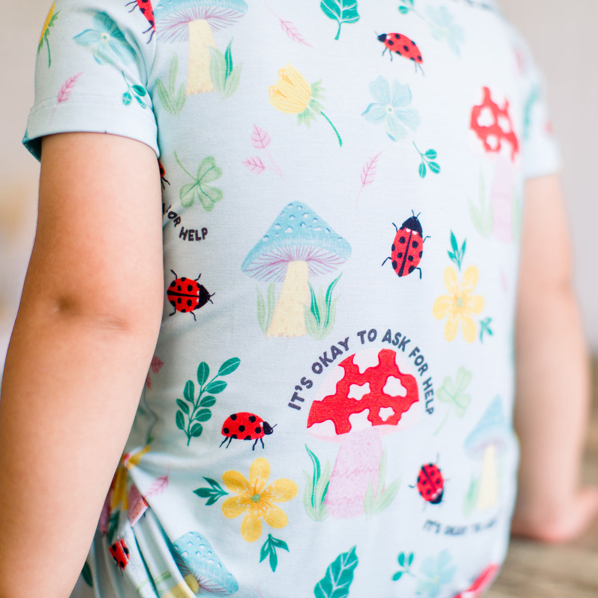 Baby wearing whimsical mushroom print bamboo pajamas from the Magic Mushroom collection